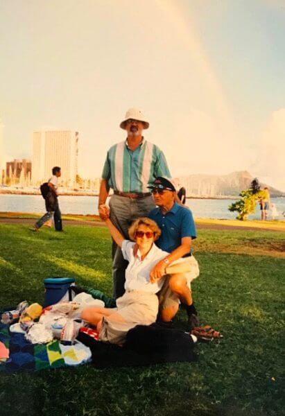 Photo of man and woman sitting on the grass