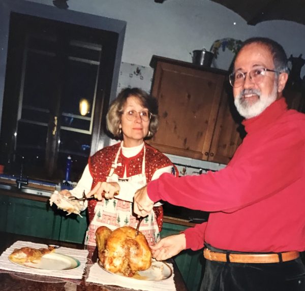 Russell and Nancy carving a turkey